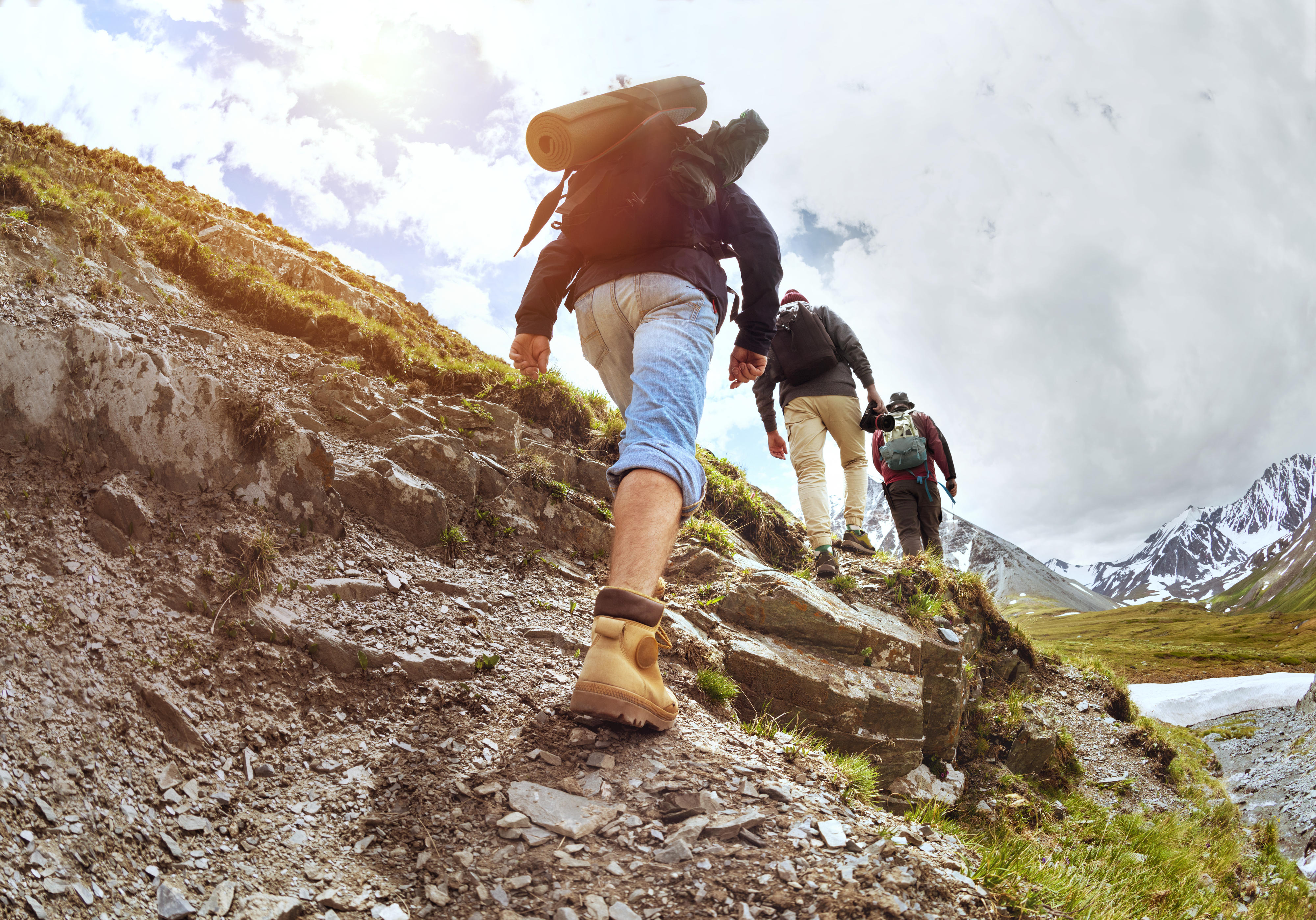 people hiking a mountain