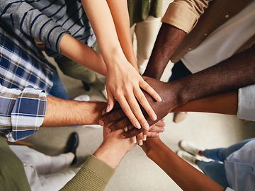 Image of hands to represent a diverse and inclusive workforce and culture.