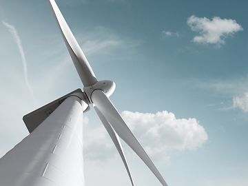 Windmill against the backdrop of a blue sky