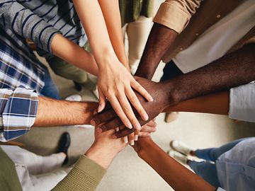 Image of hands to represent a diverse and inclusive workforce and culture.