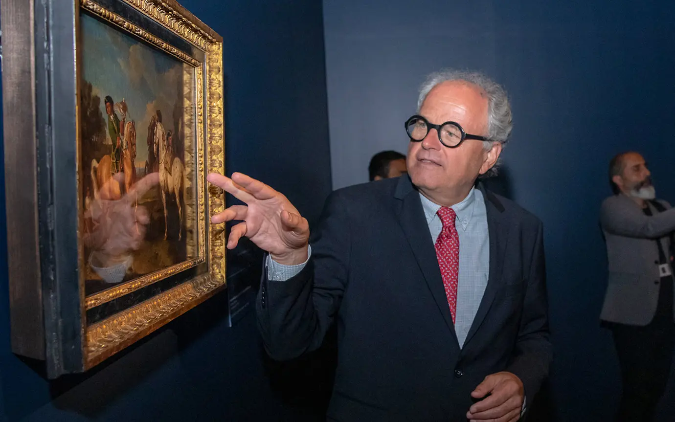 Person pointing at painting