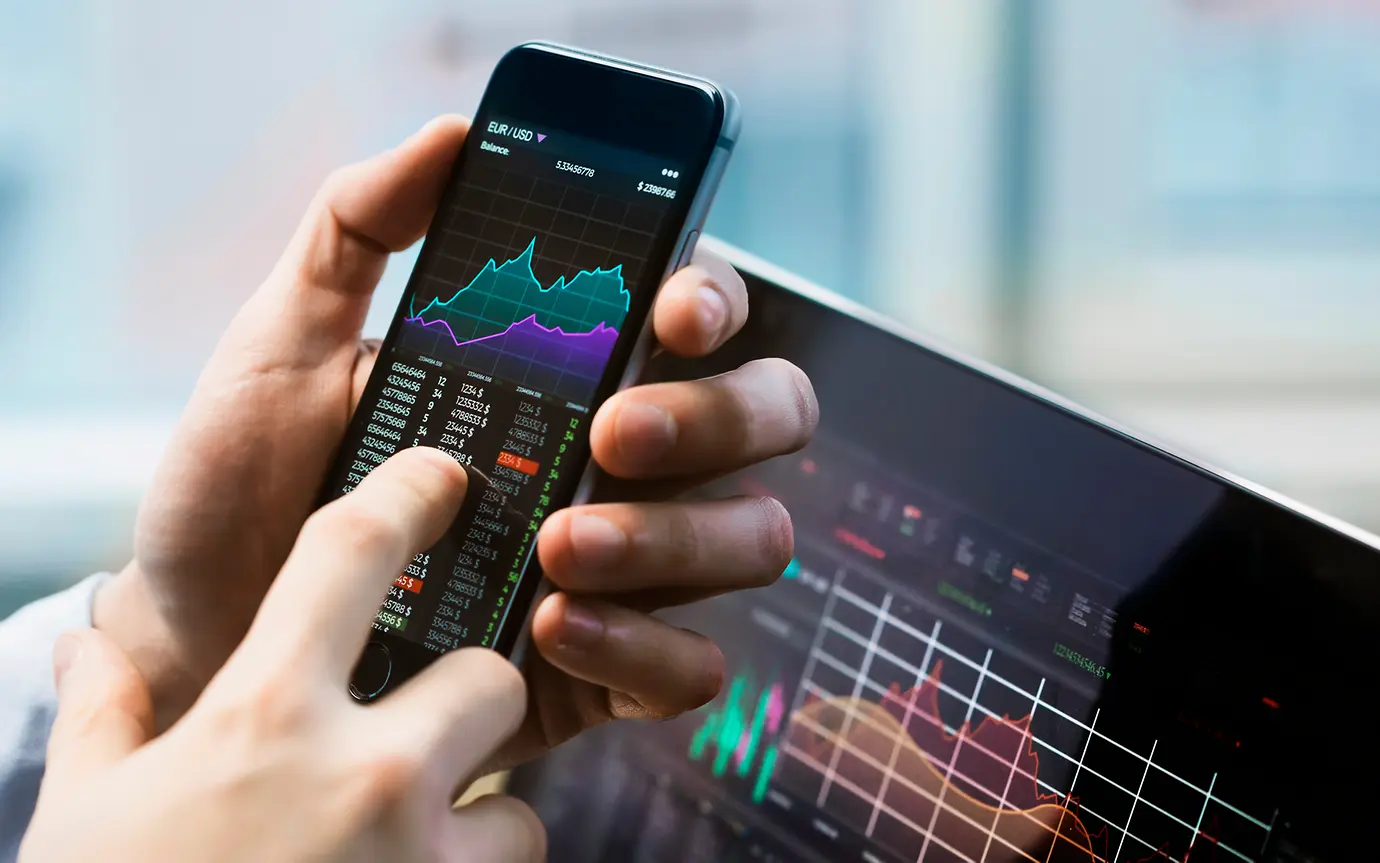 Mobile and laptop screen with charts 