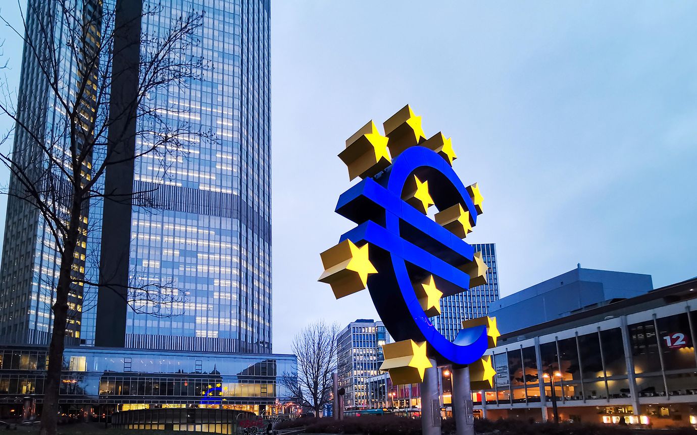 euro sign logo and buildings