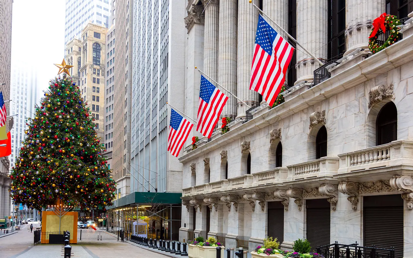 Christmas tree, USA flags, stone building