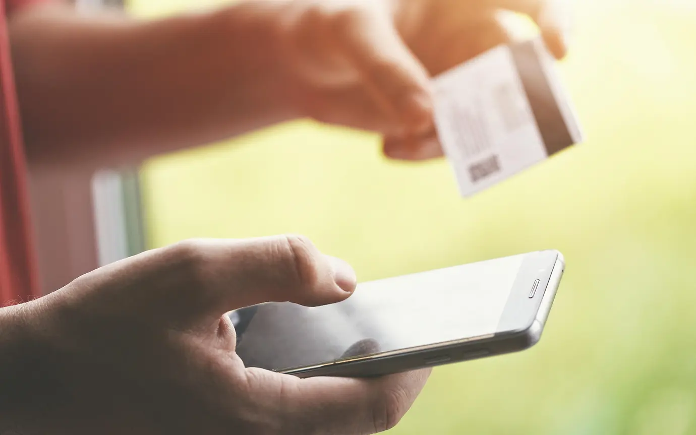 person making online payment using their phone 