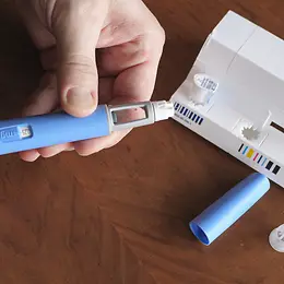 Person preparing ozempic injection