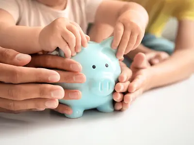 Family with piggy bank at a table