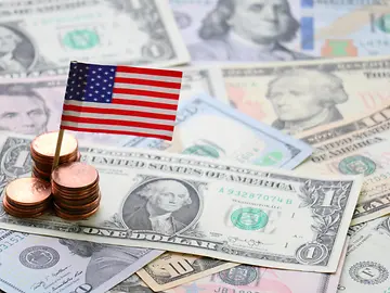 US flag sign and Dollar cash banknote and coin background