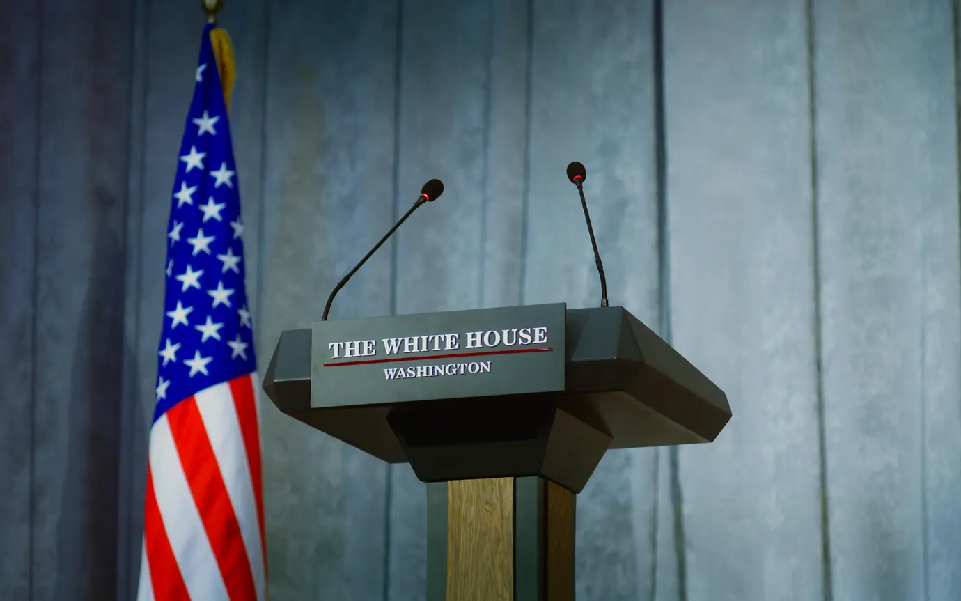 American flag and lecturn for government representative